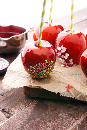 Sugar apple with red icing. Sweets paradise apple on market in Germany. Sweet candy Appleの写真素材
