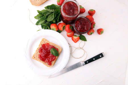 Fresh raspberry jam with toast or bread for breakfast.の写真素材