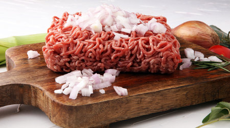 Raw pork and beef ground meat and vegetables