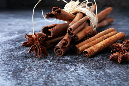 Mulled wine ingredients spices. Anise, cinnamon, cardamom on  table. の写真素材