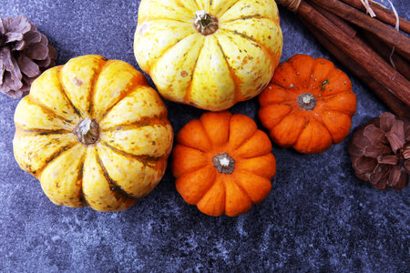 Autumn Pumpkin Thanksgiving Background orange pumpkins over table.
