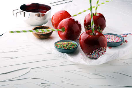 Sugar apple with red icing. Sweets paradise apple from market in Germany. Sweet candy Appleの写真素材