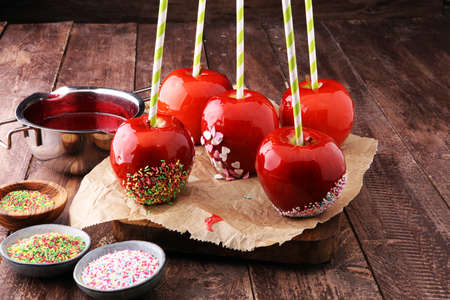 Sugar apple with red icing. Sweets paradise apple on market in Germany. Sweet candy Appleの写真素材