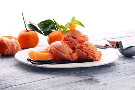 Winter Ice cream with tangerines, on wooden backgroundwith fresh mandarin