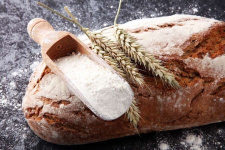 Freshly baked bread and flour in a bakery concept setの写真素材
