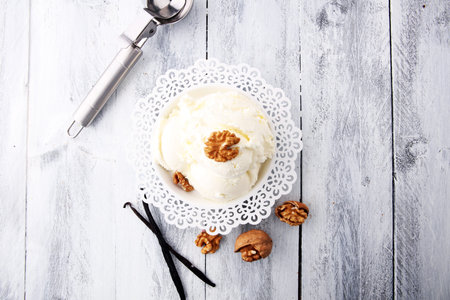 homemade oatmeal and walnut ice cream on wooden background