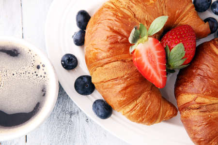 coffee and croissant with coffee beans. breakfast energy conceptの写真素材