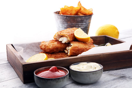 traditional British fish and chips with potato and lemonの写真素材