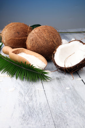 Heap of Grated Coconut on wooden background. coconut flakes concept