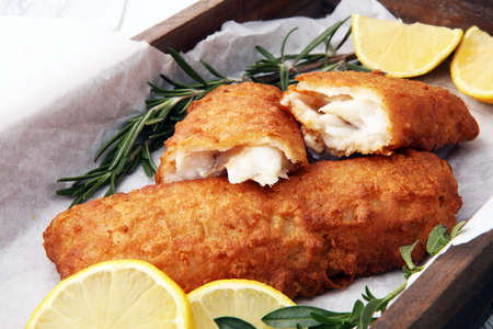 traditional British fish and chips with potato and lemonの写真素材