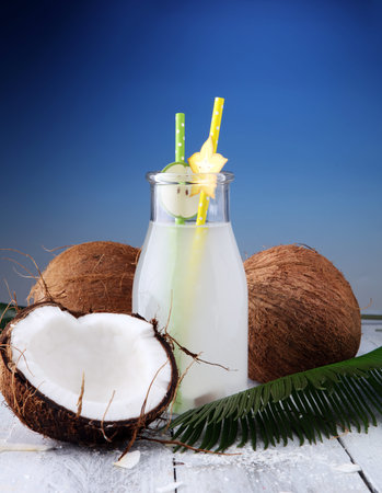 Coconut juice, Drink coconut water and coconuts on wooden background