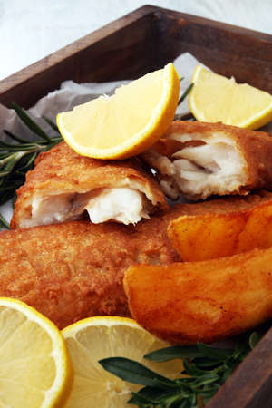 traditional British fish and chips with potato and lemonの写真素材