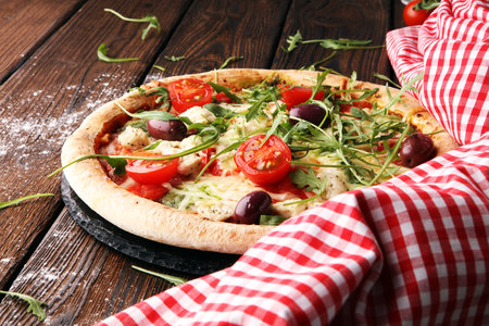 pizza with cheese fresh baked pizza coming out of the ovenの写真素材