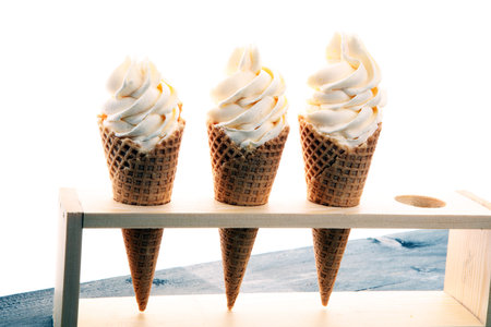 Vanilla frozen yogurt or soft ice cream in waffle cone