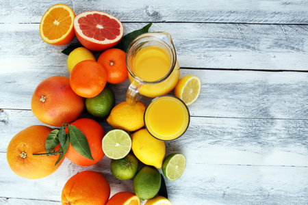 Citrus background. Assorted fresh citrus fruit. Lemon, orange lime, grapefruit. Fresh and colorful...
