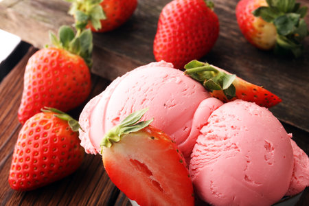 Strawberry ice cream scoop, scooped with a ice spoonの写真素材