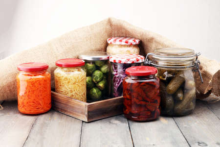 Jars with variety of pickled vegetables. Preserved foodの写真素材
