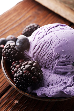 Blackberry ice cream scoop, scooped with a ice spoon