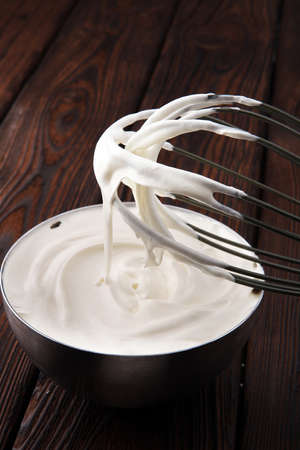 close up of a white whipped or sour cream in bowlの写真素材