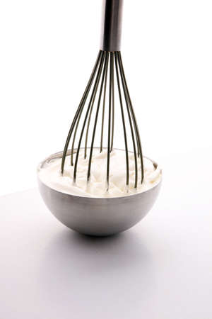 close up of a white whipped or sour cream in bowlの写真素材