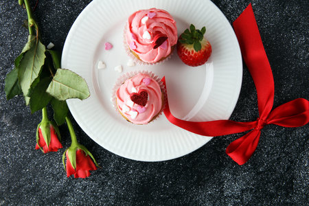 Delicious cupcake for Valentine Day. cake for Valentines day with chocolate and strawberries. Traditional homemade with red rosesの写真素材