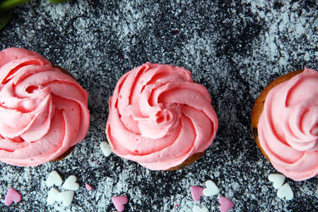 Delicious cupcake for Valentine Day. cake for Valentines day with chocolate and strawberries. Traditional homemade with red rosesの写真素材