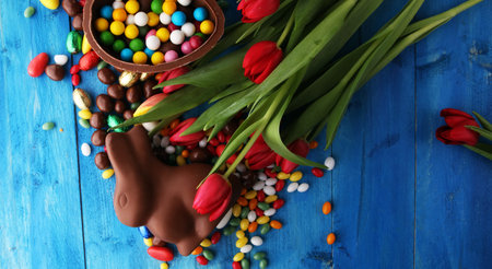 Chocolate Easter eggs and bunny with fresh easter flower