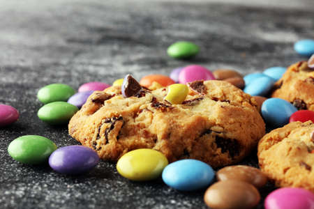 Chocolate cookies with colorful candies. Chocolate chip smarties cookies.の写真素材