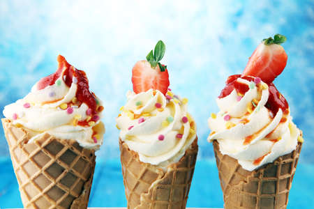 Vanilla frozen yogurt or soft ice cream in waffle coneの写真素材