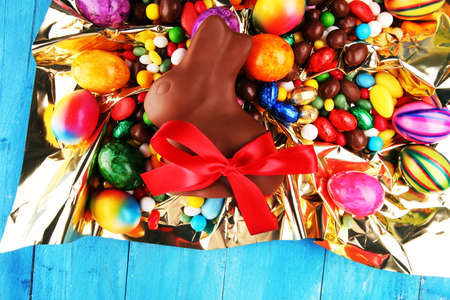 Chocolate Easter eggs and chocolate bunny and colorful sweetsの写真素材