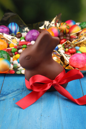 Chocolate Easter eggs and chocolate bunny and colorful sweets