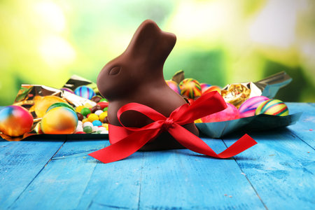Chocolate Easter eggs and chocolate bunny and colorful sweets