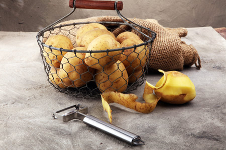 potato food . Fresh raw organic potatoes on old vintage backgroundの写真素材