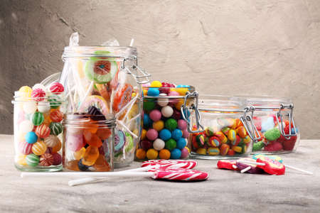 candies with jelly and sugar. colorful array of different childs sweets and treatsの写真素材