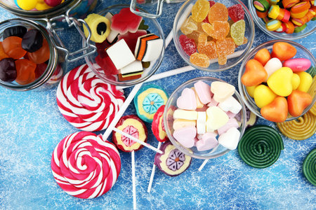 candies with jelly and sugar. colorful array of different childs sweets and treatsの写真素材