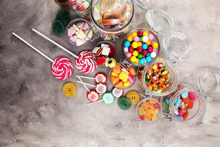candies with jelly and sugar. colorful array of different childs sweets and treats