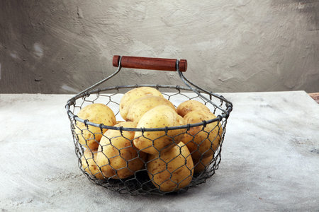 potato food . Fresh raw organic potatoes on old vintage backgroundの写真素材