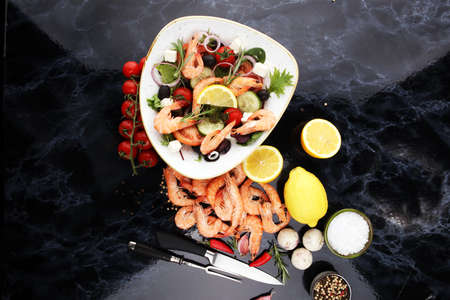 tasty meal with fresh and healthy prawn salad and vegetables. Prawns Langostino Austral. shrimp seafood with lemon and spicesの写真素材