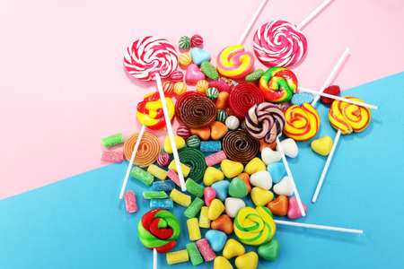 candies with jelly and sugar. colorful array of different childs sweets and treatsの写真素材