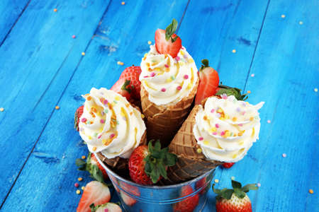 Vanilla frozen yogurt or soft ice cream in waffle coneの写真素材