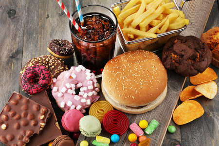 Unhealthy products. food bad for figure, skin, heart and teeth. Assortment of fast carbohydrates food. の写真素材