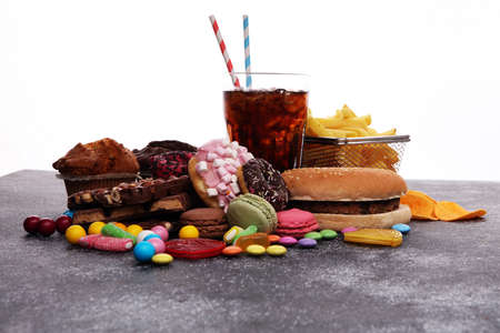 Unhealthy products. food bad for figure, skin, heart and teeth. Assortment of fast carbohydrates food. の写真素材