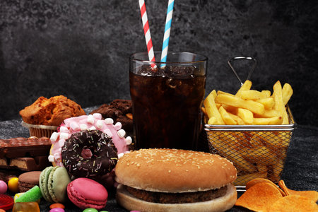Unhealthy products. food bad for figure, skin, heart and teeth. Assortment of fast carbohydrates food. の写真素材