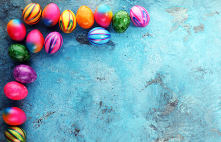 Row of Easter eggs on blue background. easter decorationの写真素材