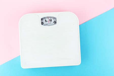 weight measure flat lay on colored paperの写真素材