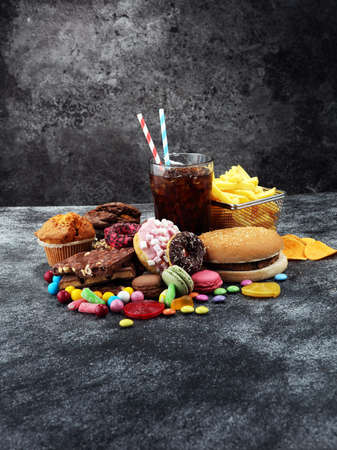 Unhealthy products. food bad for figure, skin, heart and teeth. Assortment of fast carbohydrates food. の写真素材