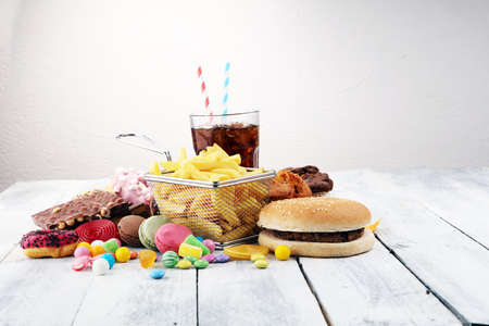 Unhealthy products. food bad for figure, skin, heart and teeth. Assortment of fast carbohydrates food. の写真素材