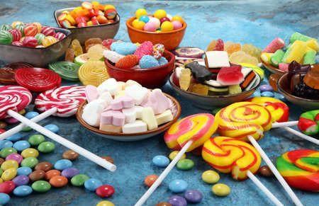 candies with jelly and sugar. colorful array of different childs sweets and treatsの写真素材