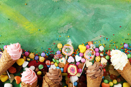 candies with jelly and sugar. colorful array of different childs sweets and treatsの写真素材