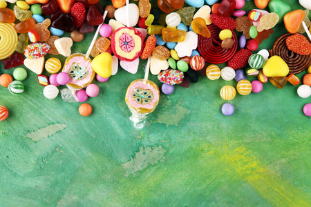 candies with jelly and sugar. colorful array of different childs sweets and treats